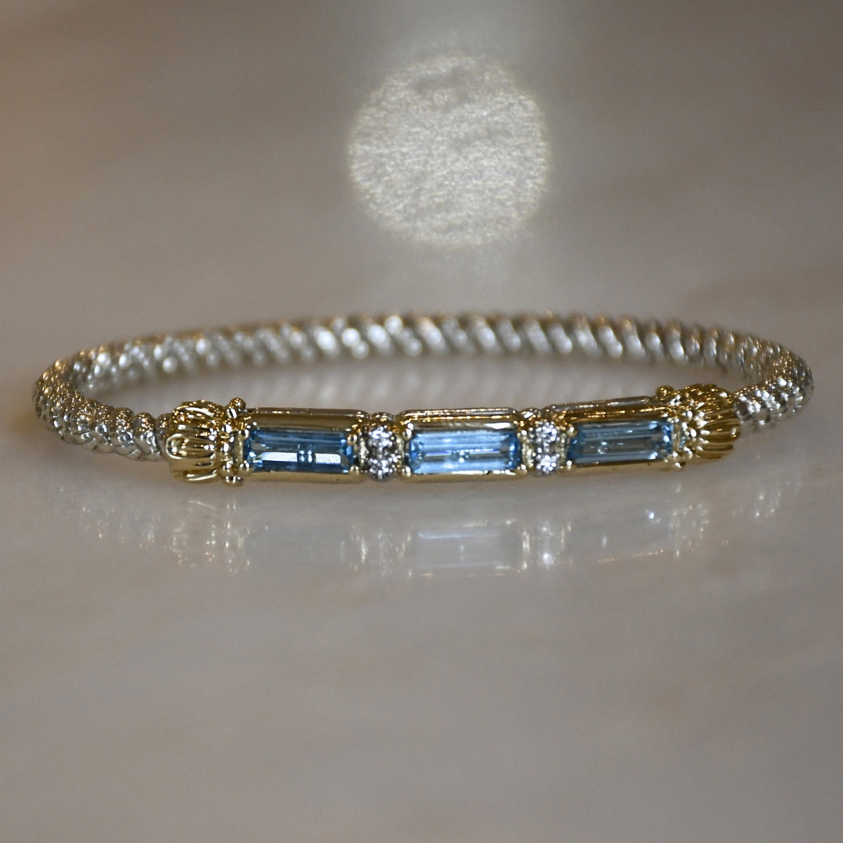 14ky/Sterling Silver Blue Topaz Closed Bangle Bracelet