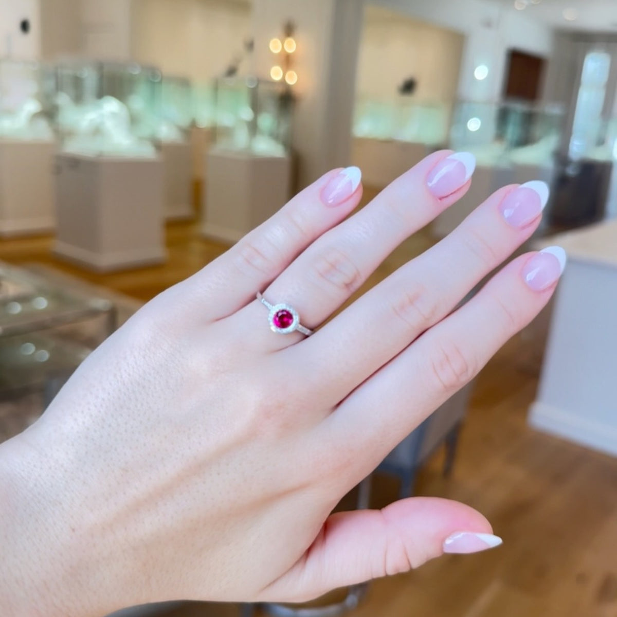 Red Corundum & Diamond Halo Ring