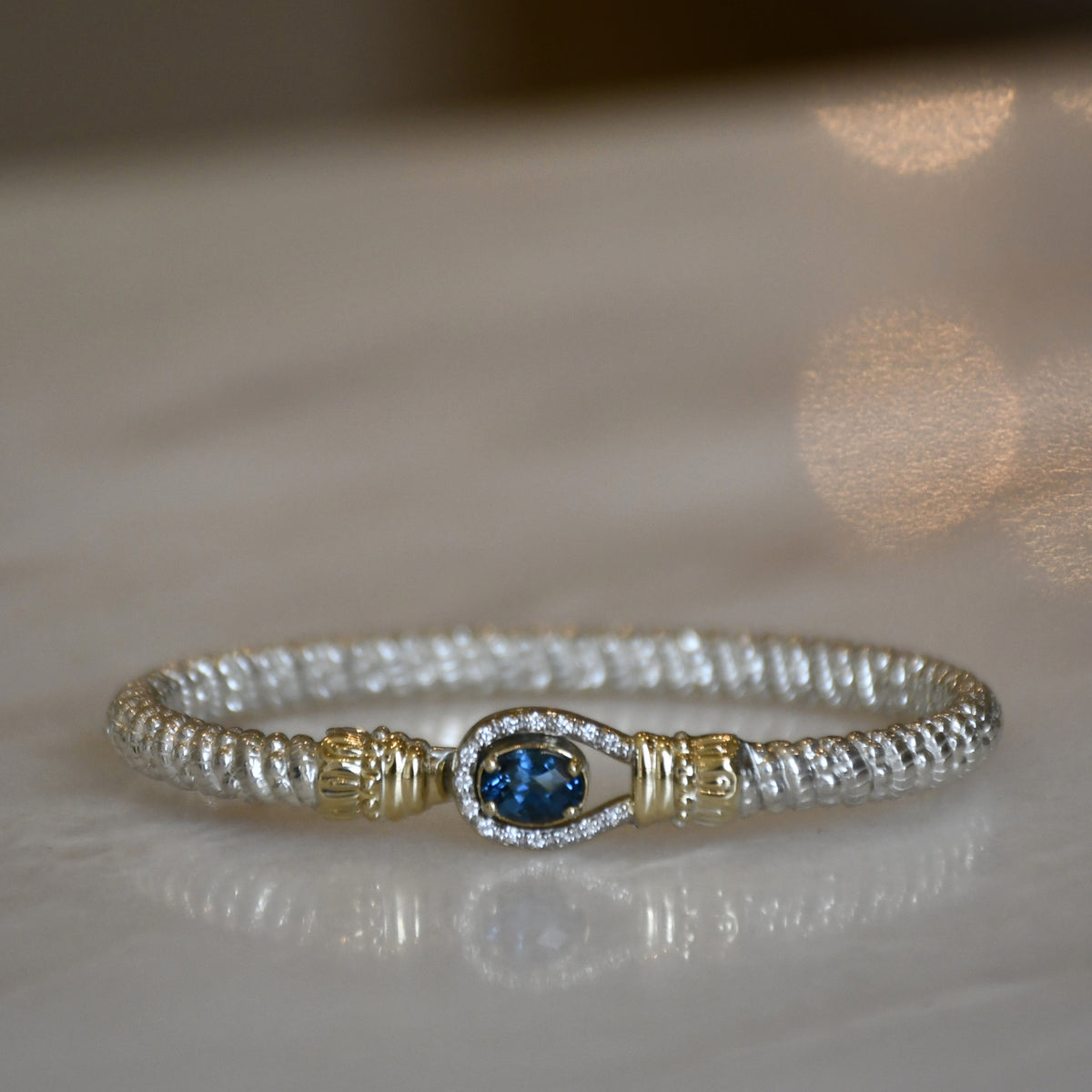 14ky/Sterling Silver Closed London Blue Topaz Lasso Bangle Bracelet